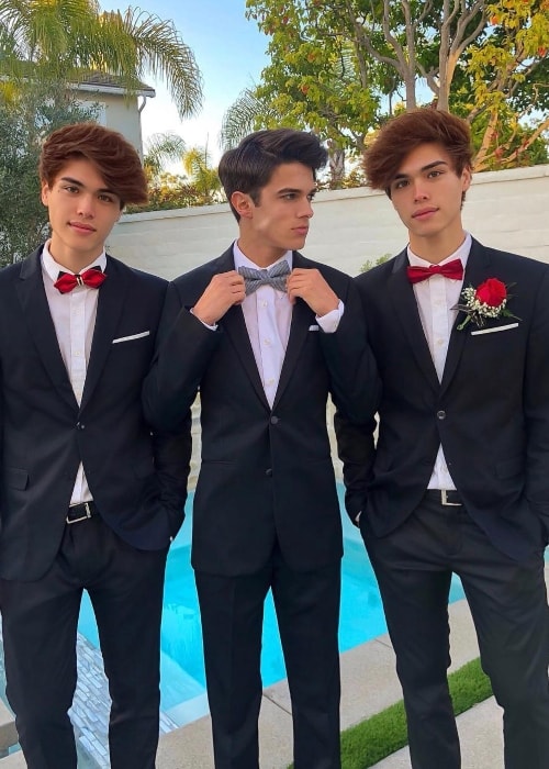 Alex Stokes as seen while posing with his friend, Brent Rivera (Center), and his older twin, Alan Stokes (Right), in September 2018