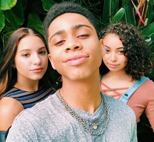 Bryce Xavier as seen while taking a selfie with Devenity Perkins (Right) and Kenzie in December 2018