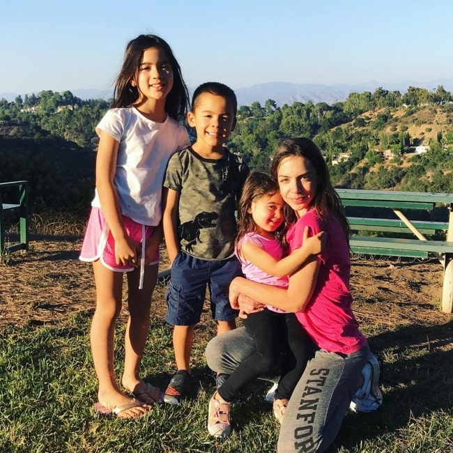 Ford Walker as seen in a picture taken with his mother Elle and sisters Tess and Presley Walker in July 2020