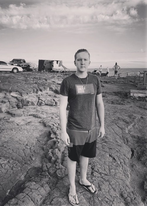 Isaac Coffee as seen while posing for the camera in a black-and-white picture in June 2019
