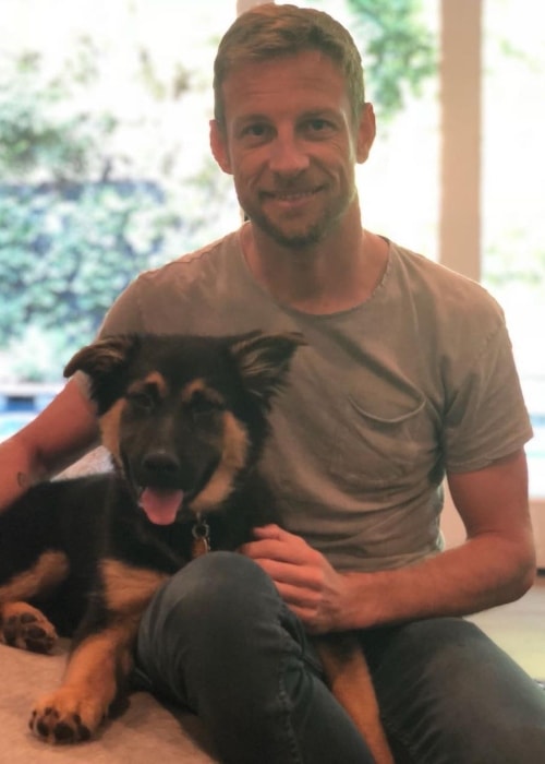 Jenson Button posing with his dog before leaving for Japan in April 2018