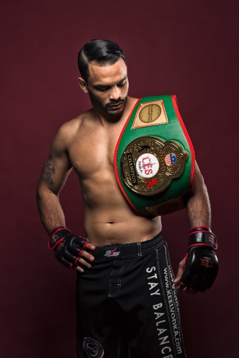 Rob Font as seen with his CES Featherweight Championship belt in 2013