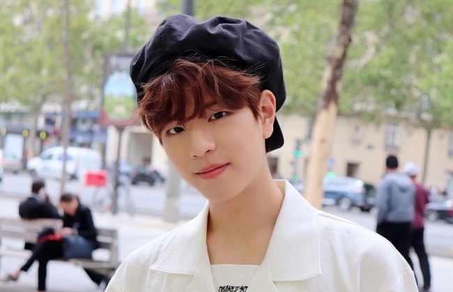 Seungmin as seen while posing for a picture in August 2019