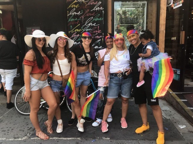 Sijara Eubanks (Corner Right) holding her baby while celebrating the NYC Pride March with her friends in May 2018