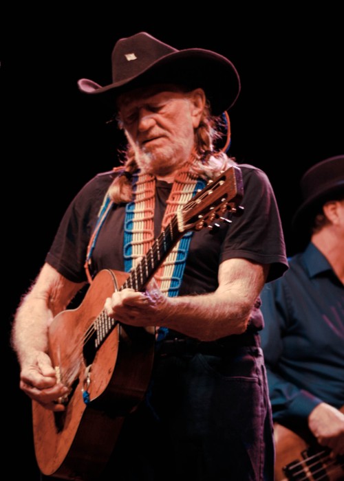 Willie Nelson performing on stage as seen in June 2011